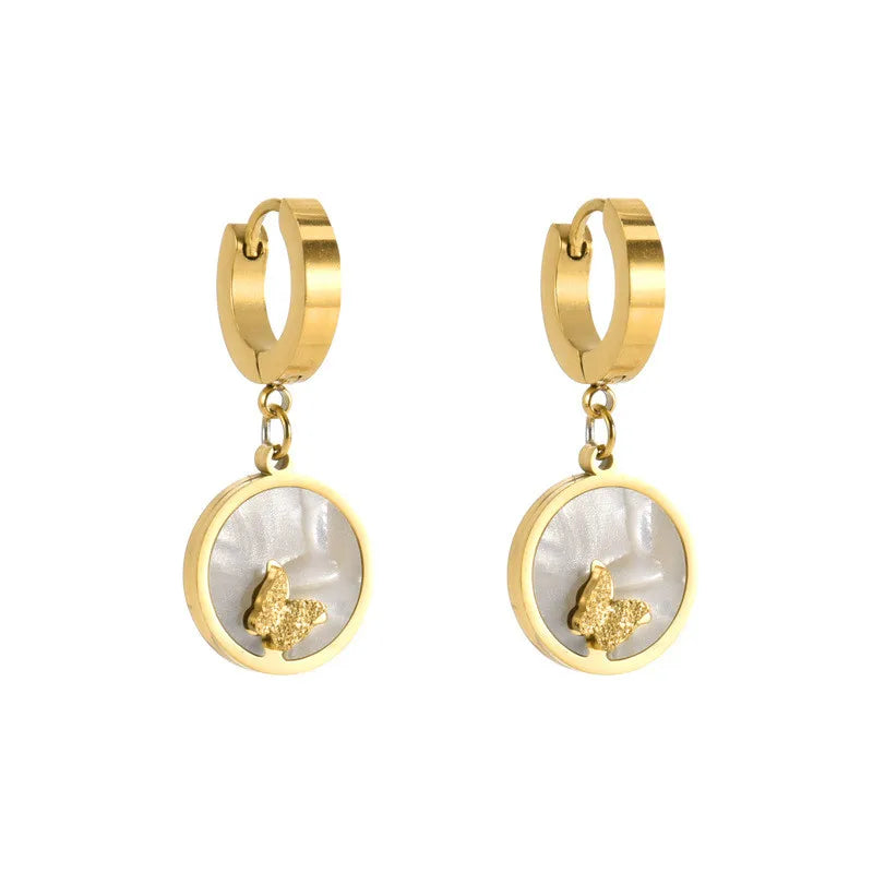 Schmuckset mit Muschel-und Schmetterlingsmotiv aus Edelstahl 316L.