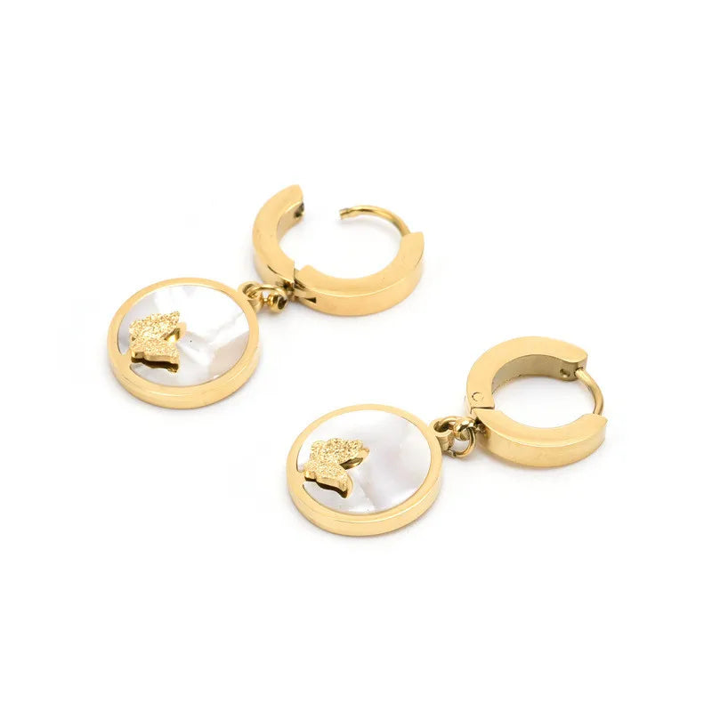 Schmuckset mit Muschel-und Schmetterlingsmotiv aus Edelstahl 316L.